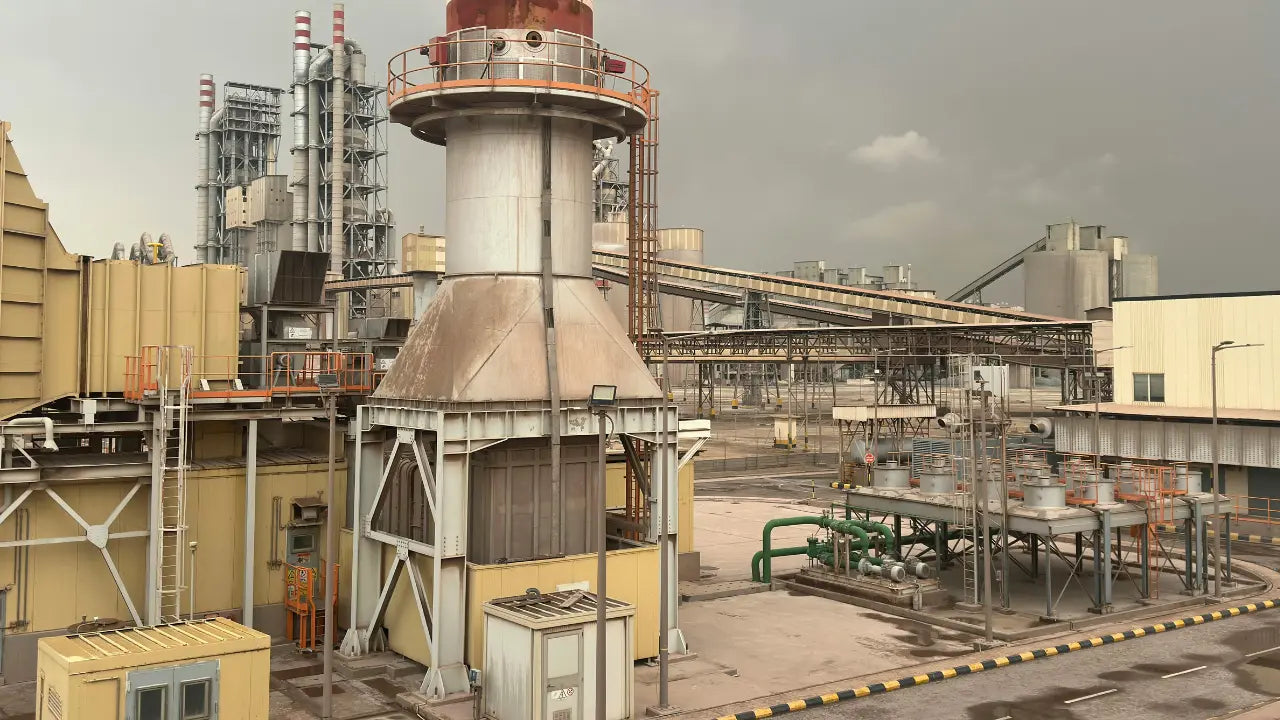 Industrial filtration systems in a modern cement manufacturing plant with dust collection, hydraulic equipment and process filtration applications