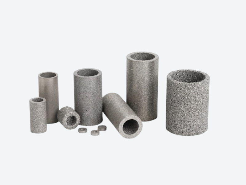 Sintered porous metal cup component for precision filtration and flow control