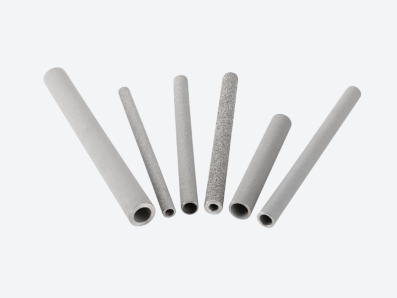 Sintered porous metal tubes for precision filtration and controlled gas/liquid flow