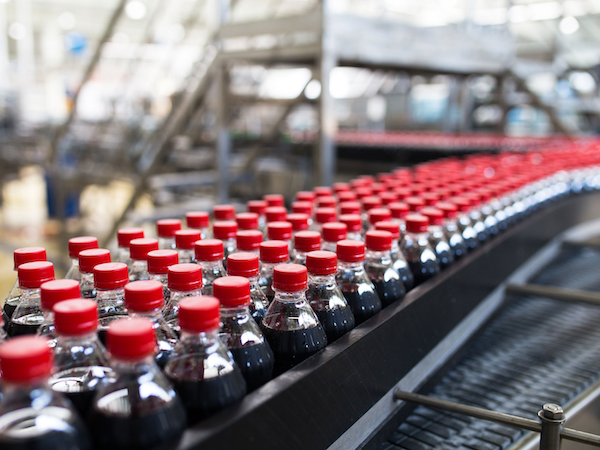 Industrial soft drink production line with beverage filtration systems